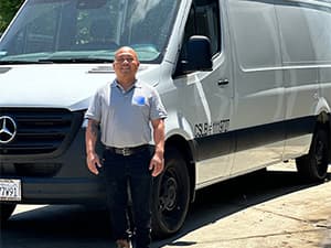Sy of Granite Bay Heating & Air, standing in front of a company service van in Granite Bay CA Sy of Granite Bay Heating & Air, standing in front of a company service van in Granite Bay CA