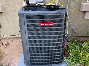 AC Replacement Inspection – Granite Bay HVAC Technician inspecting air conditioning unit for potential replacement in Granite Bay, CA