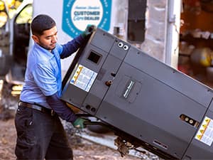 New furnace delivery and installation – Granite Bay Heating & Air HVAC technician transporting a new residential furnace for professional installation in Granite Bay, CA