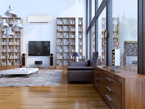 Energy-efficient ductless system for living room comfort Ductless mini-split air conditioning system installed in a residential living room