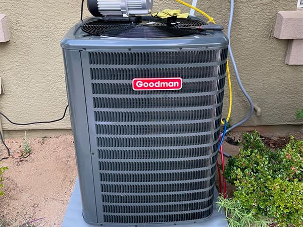 AC Replacement Inspection – Granite Bay HVAC Technician inspecting air conditioning unit for potential replacement in Granite Bay, CA