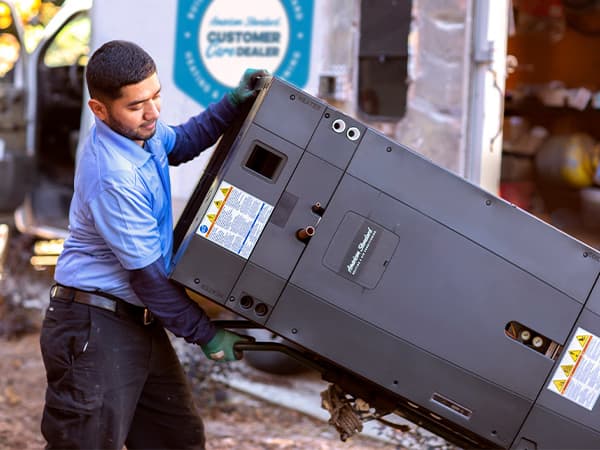 New furnace delivery and installation – Granite Bay Heating & Air HVAC technician transporting a new residential furnace for professional installation in Granite Bay, CA