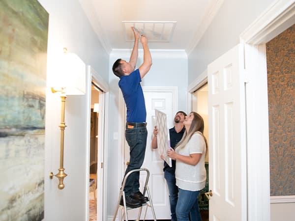 Professional air filter installation – Granite Bay Heating & Air Technician installing a residential HVAC air filter to improve indoor air quality in Granite Bay, CA