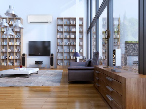 Energy-efficient ductless system for living room comfort Ductless mini-split air conditioning system installed in a residential living room